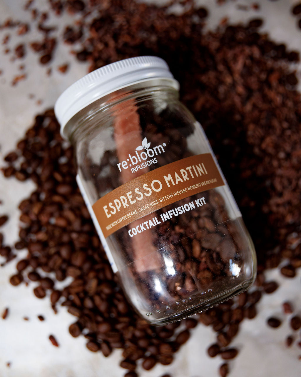 Espresso Martini Cocktail Infusion Jar surrounded by coffee beans