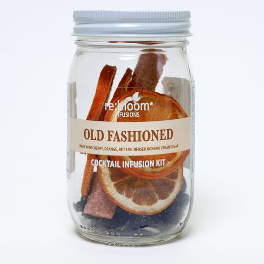 Cocktail infusion kit in a glass jar with a label on a white background.