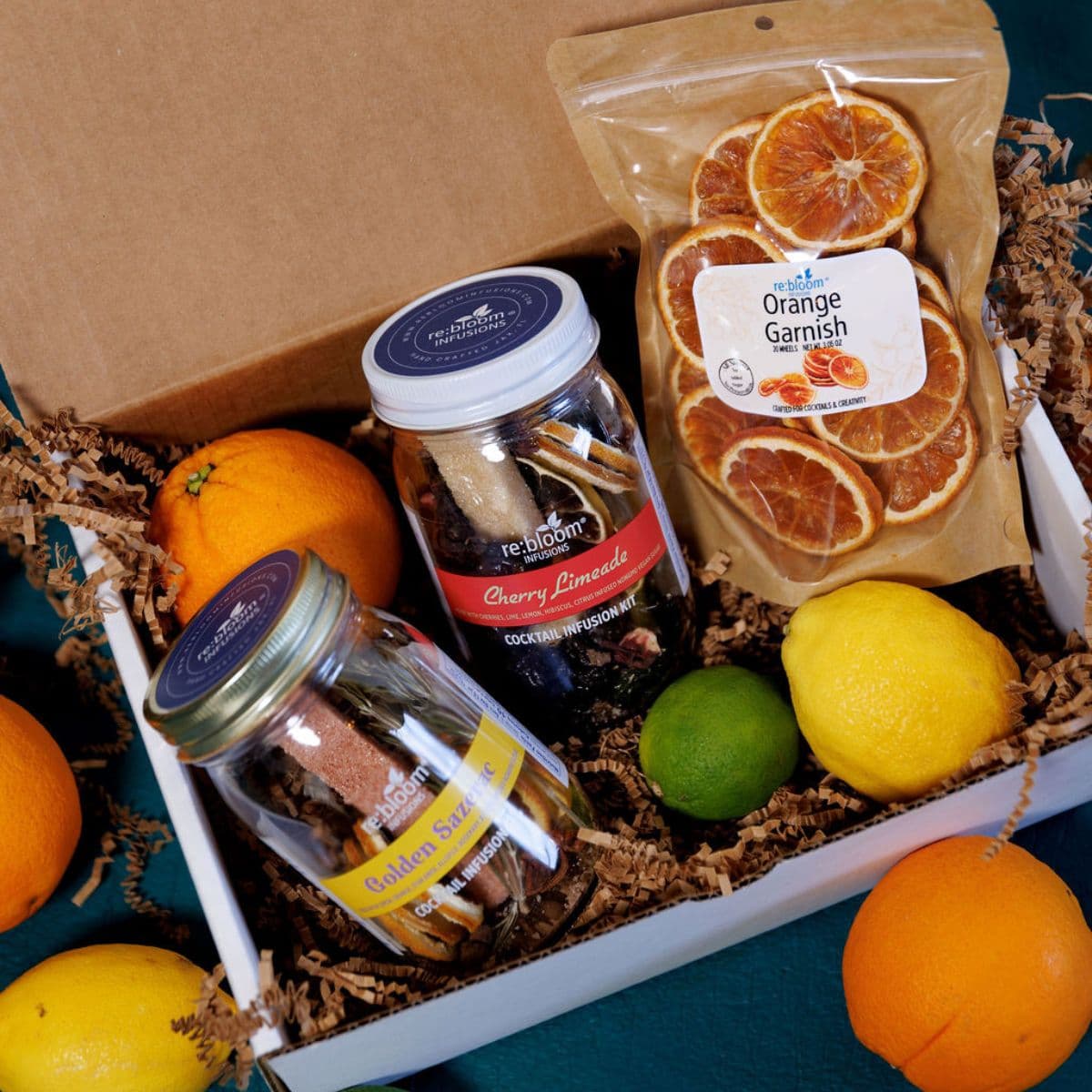 Cocktail infusion kit gift set with infusion jars and dried orange garnish in a gift box