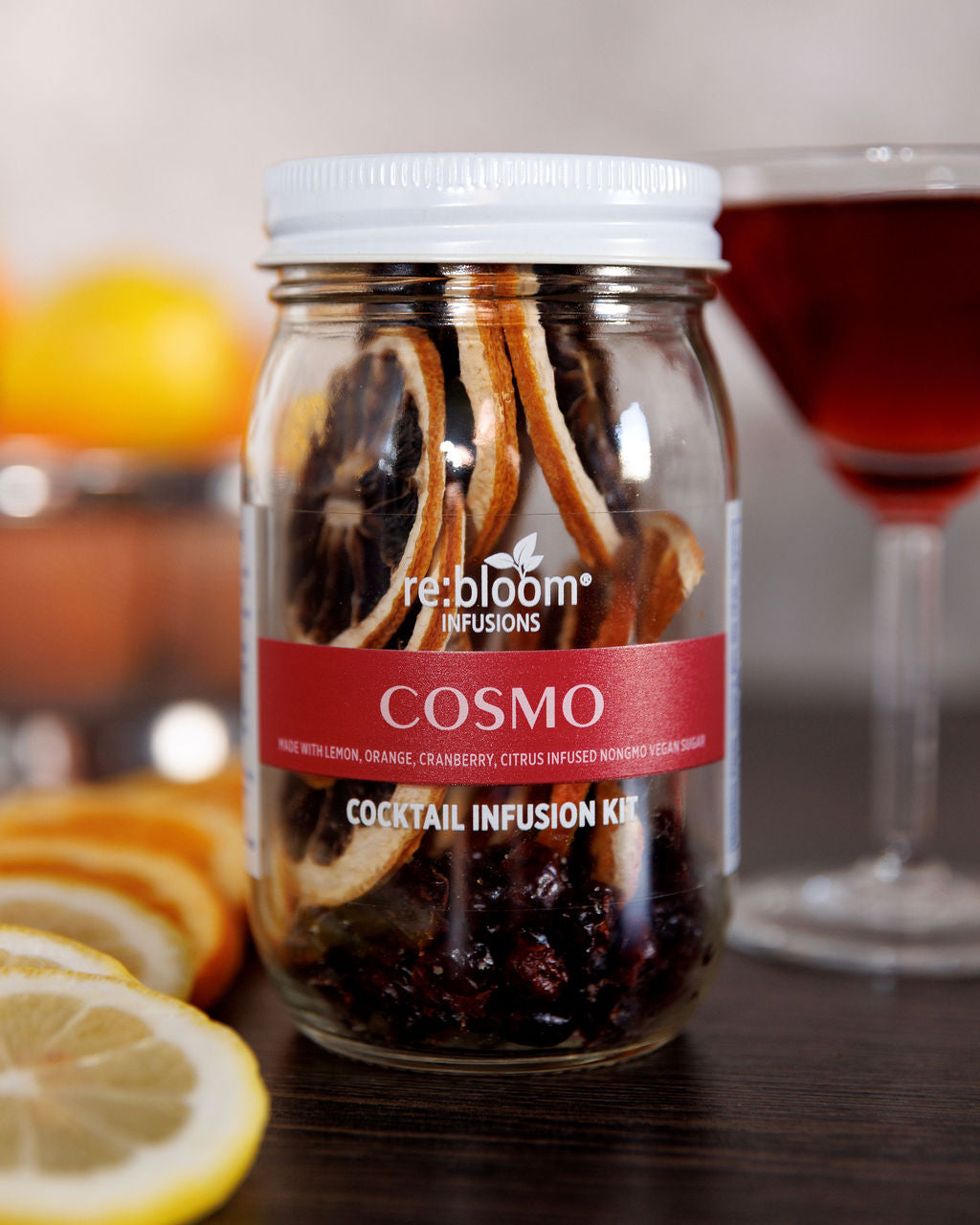 Cosmo dehydrated infusion kit on a wood shelf with a martini glass 