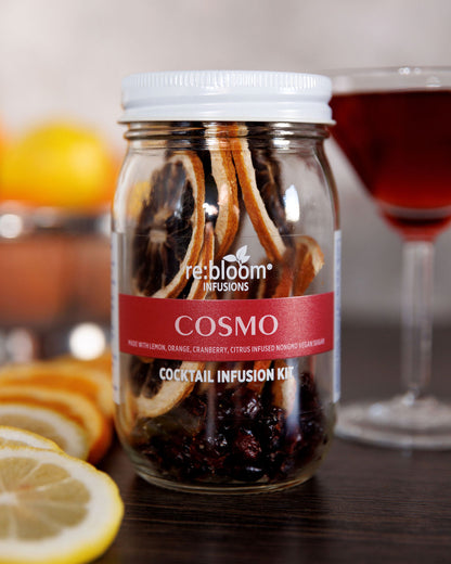Cosmo dehydrated infusion kit on a wood shelf with a martini glass 