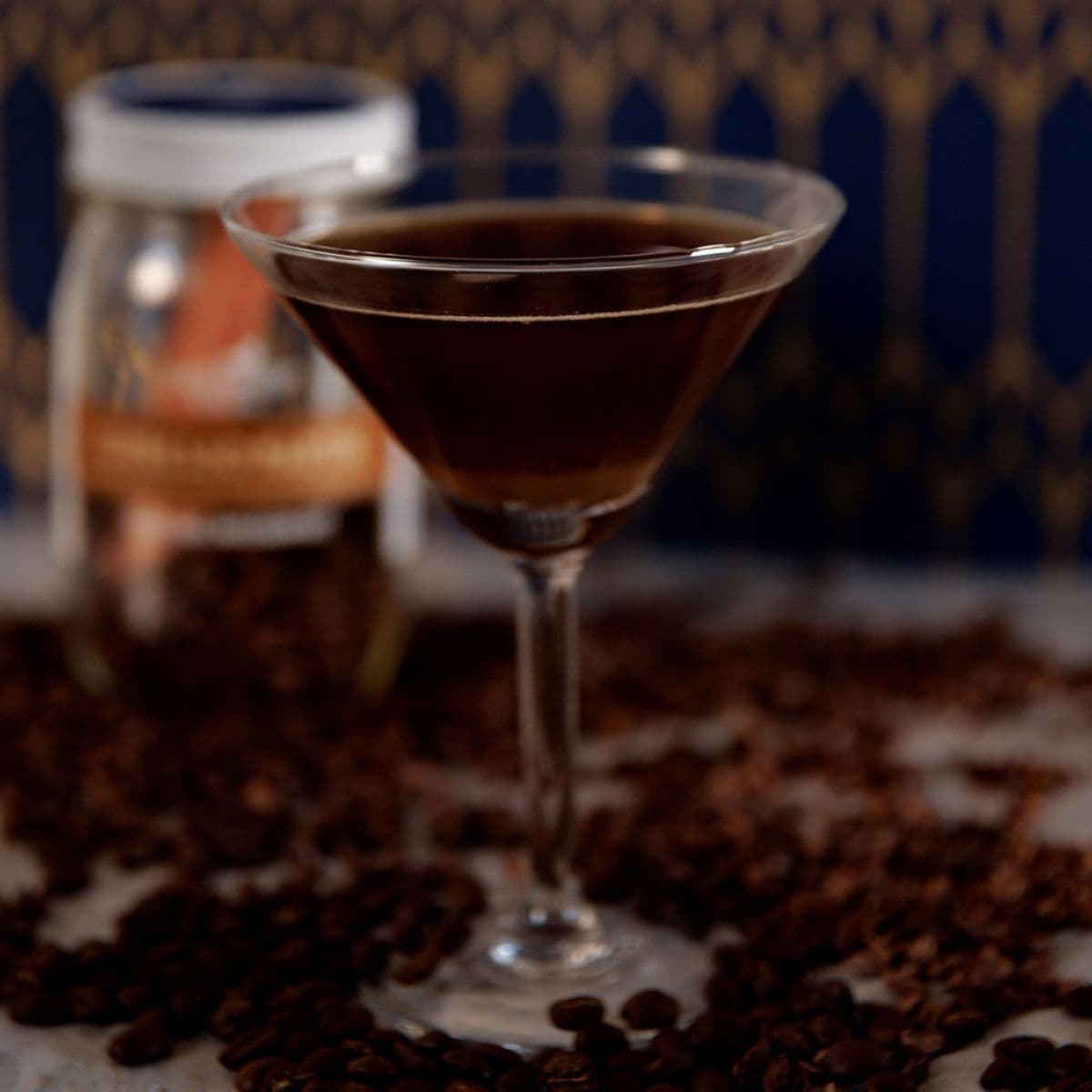 Espresso martini in a martini glass with coffee beans for cocktail presentation
