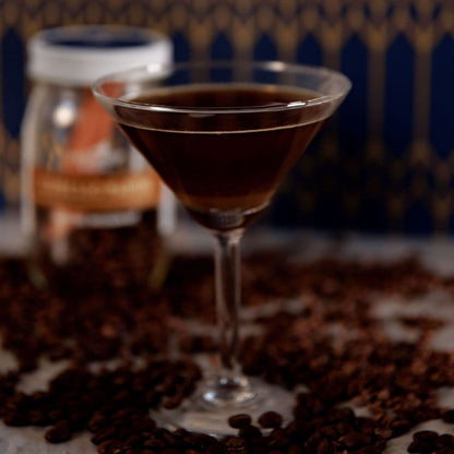 Espresso martini in a martini glass with coffee beans for cocktail presentation