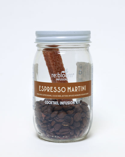 Espresso Martini cocktail infusion kit with coffee beans, cacao nibs and bitters infused sugar bar in a glass jar on a white background.