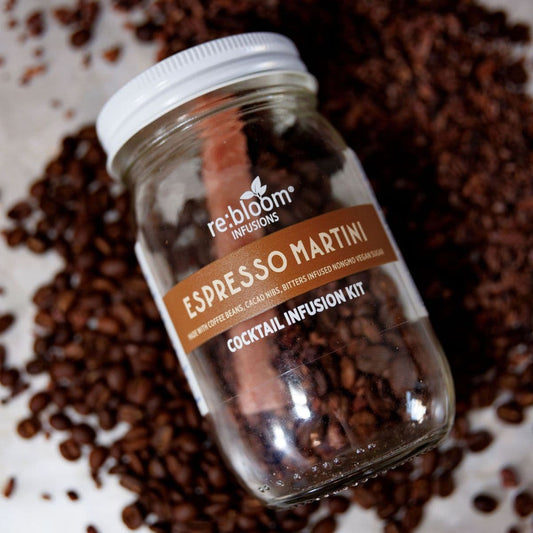 Espresso martini cocktail infusion jar with coffee beans background 