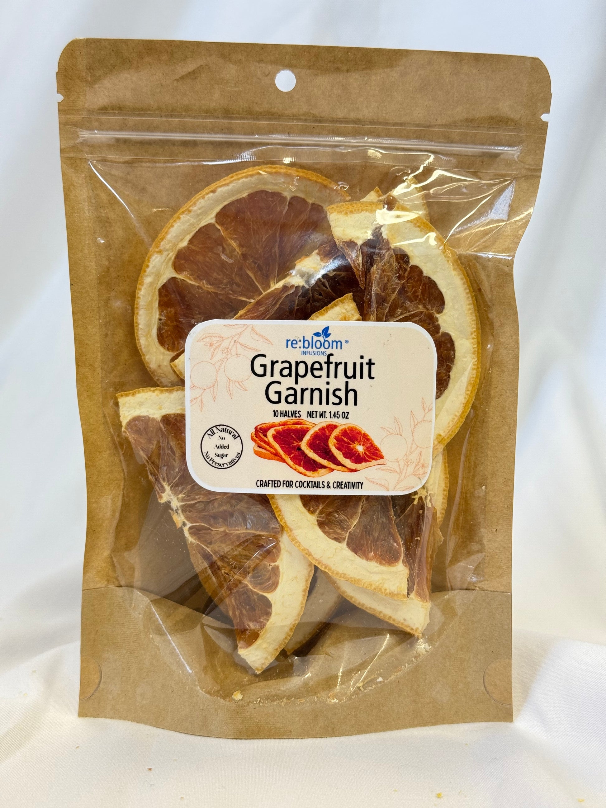 Packaged grapefruit garnish with a label on a white background