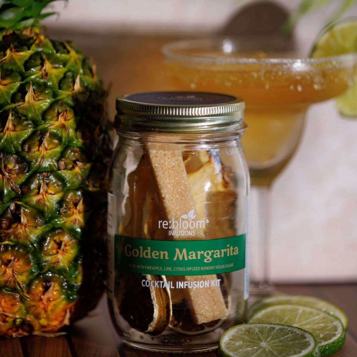 Golden Margarita cocktail infusion kit with pineapple, lime slices, and margarita cocktail by re:bloom Infusions