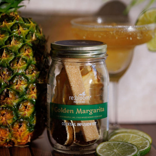 Golden Margarita cocktail infusion kit with pineapple, lime slices, and margarita cocktail by re:bloom Infusions