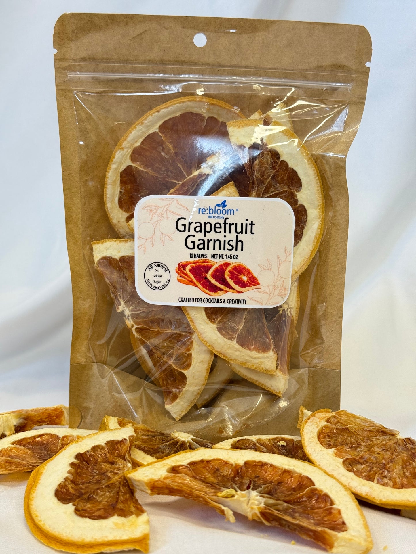 Packaged dried grapefruit slices with a visible brand label on a white background