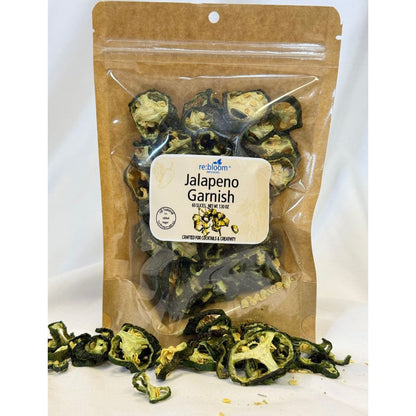 Packaged dried jalapeño garnish slices with visible re:bloom Infusions label on a white background.