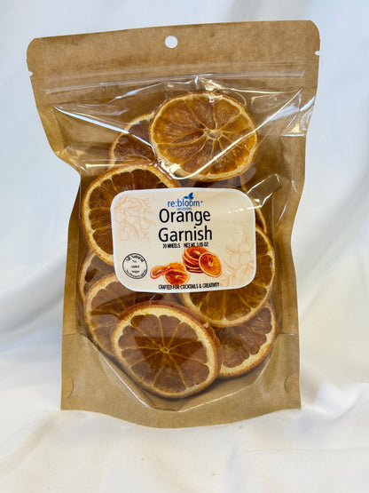 Packaged dried orange slices with a visible label on a white background