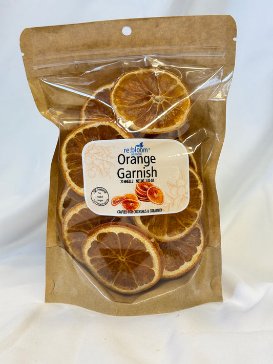 Packaged dried orange slices with a visible label on a white background