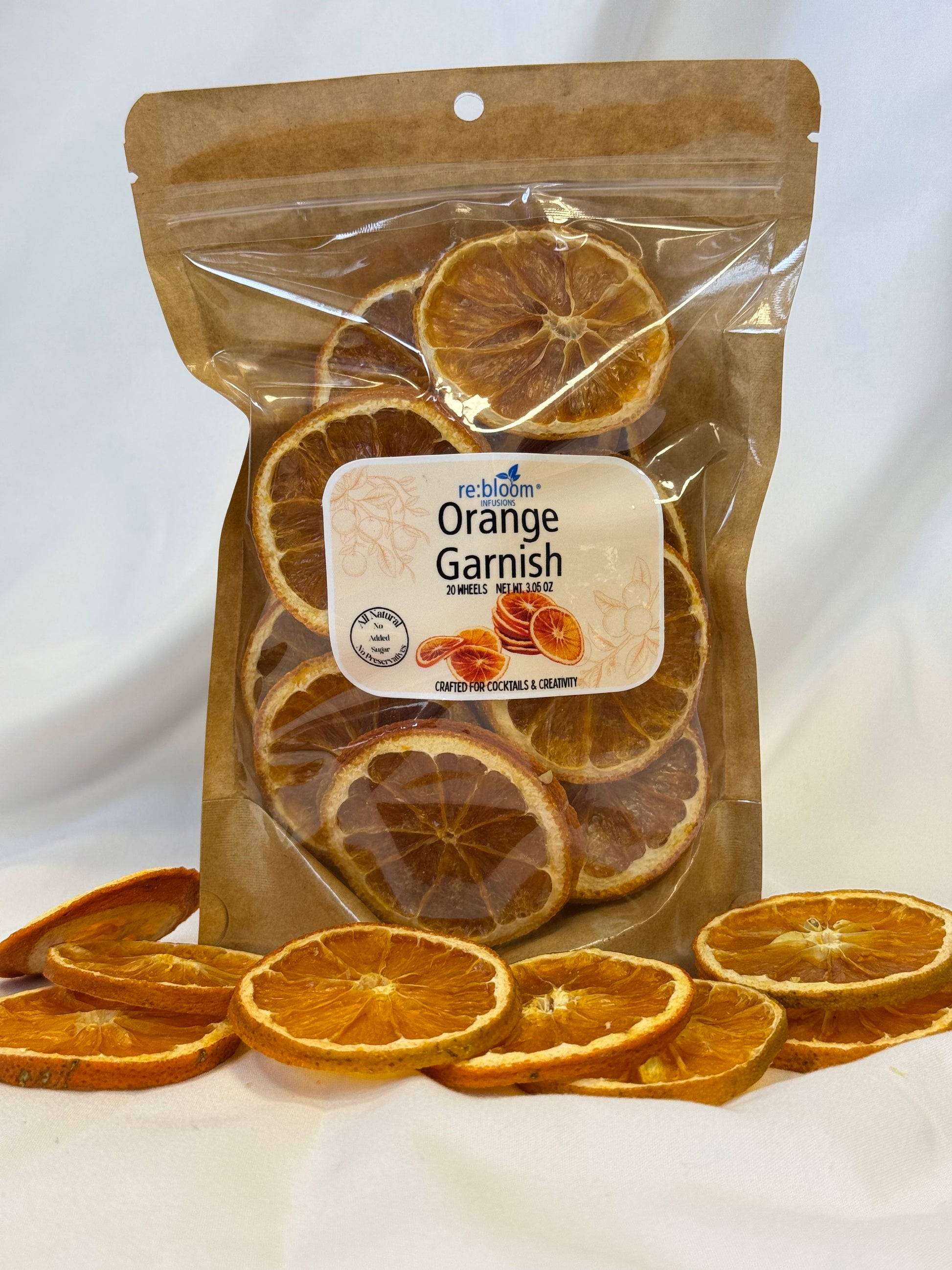 Packaged dried dehydrated orange garnishes with a visible brand label on a white background