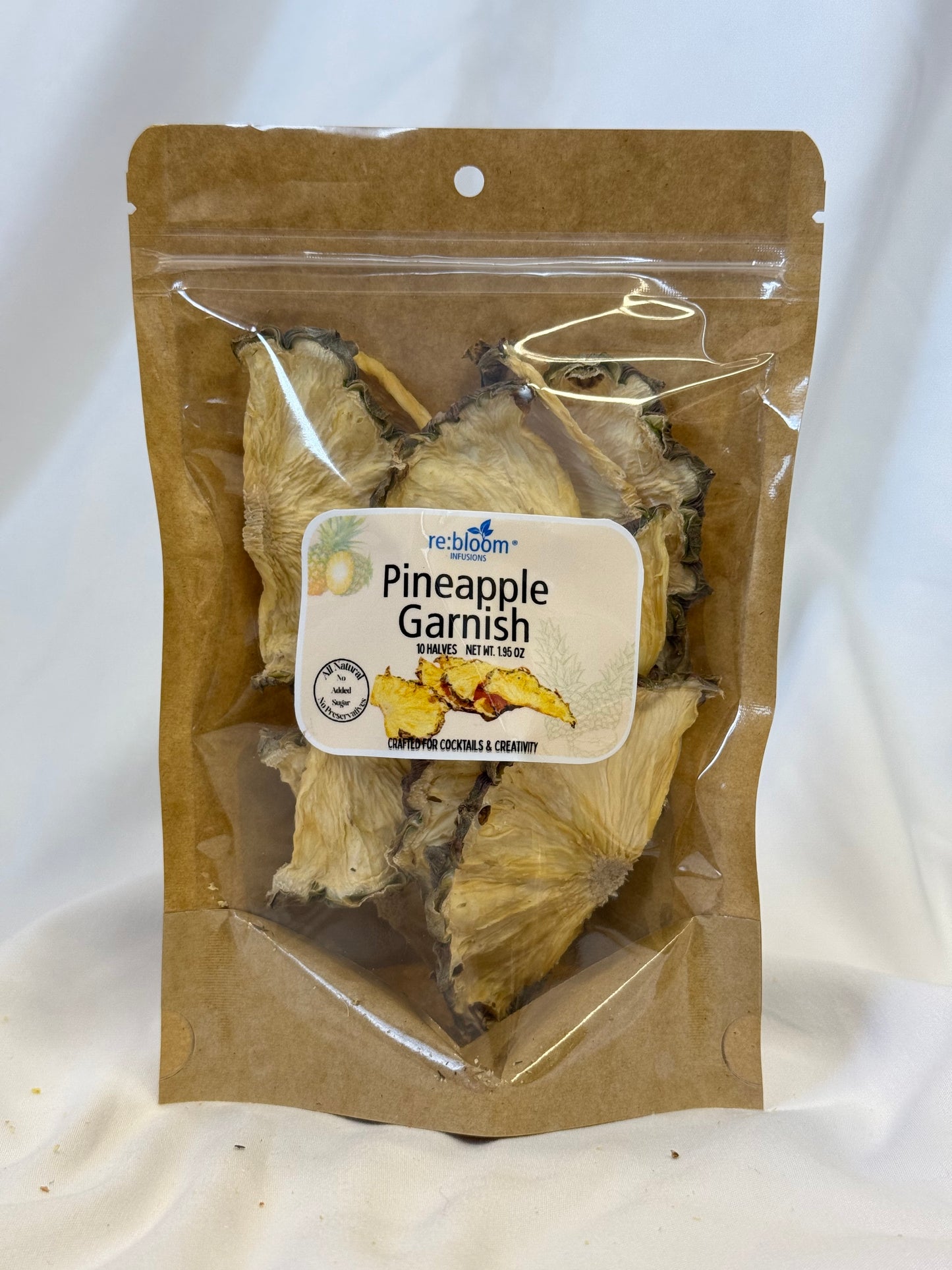 Packaged pineapple garnish with a label on a white background