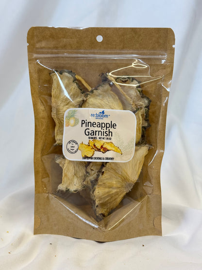 Packaged pineapple garnish with a label on a white background