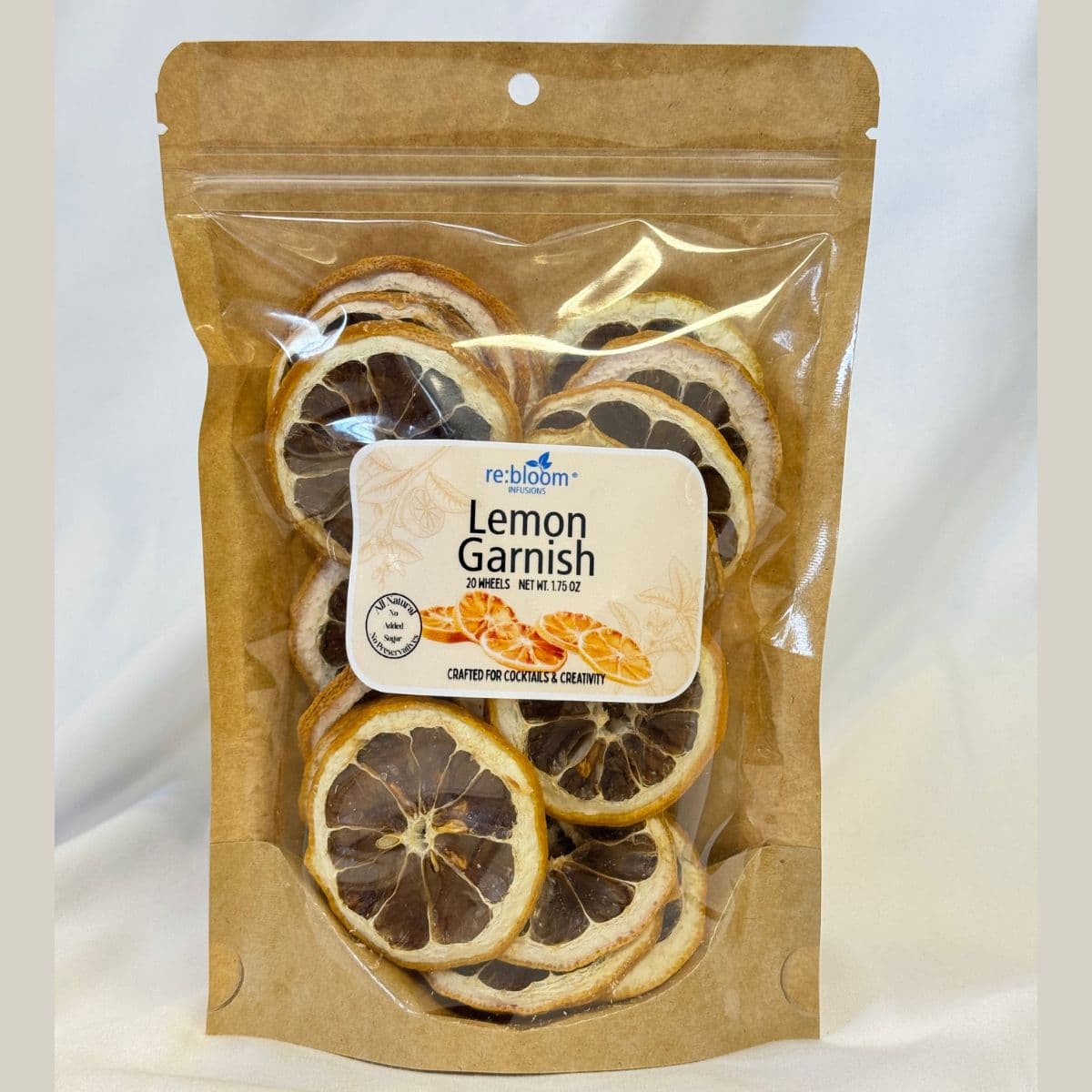 Dried lemon garnish slices packaged in a bag for cocktails and mocktails on a white background.