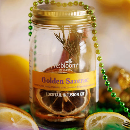 Golden Sazerac cocktail infusion kit with lemon slices, rosemary, and spices in glass jar by Rebloom Infusions