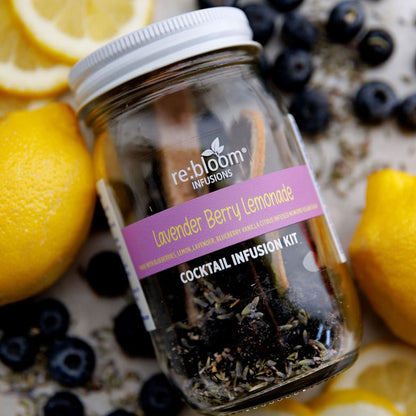 Lavender berry lemonade cocktail infusion kit with lemon slices, blueberries, and lavender in glass jar by Rebloom Infusions