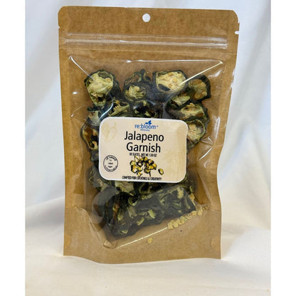 Packaged jalapeño garnish slices with visible re:bloom Infusions label on a white background.