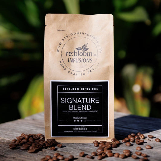 Signature blend coffee medium roast by Rebloom Infusions with whole coffee beans on wooden table